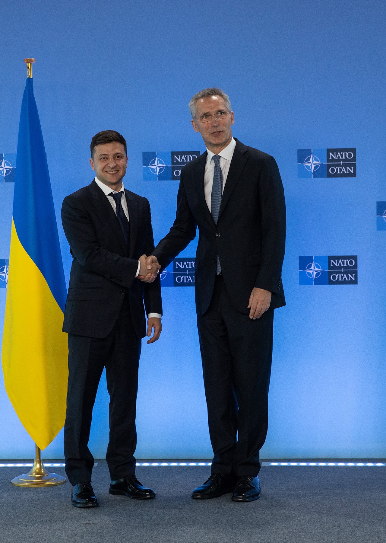 Pictured is US President Biden holding a virtual summit with Russian President Vladimir Putin. Credit: https://commons.wikimedia.org/wiki/Pictured is current Ukrainian President Volodymyr Zelensky with NATO Secretary Gen
